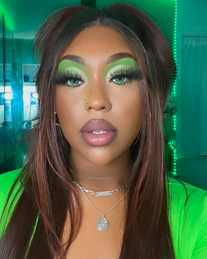 black girl with green contact lenses